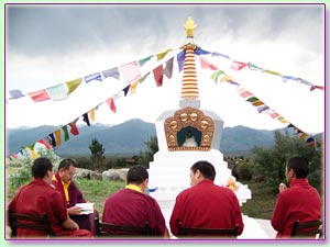 Monks seated for stupa ceremony